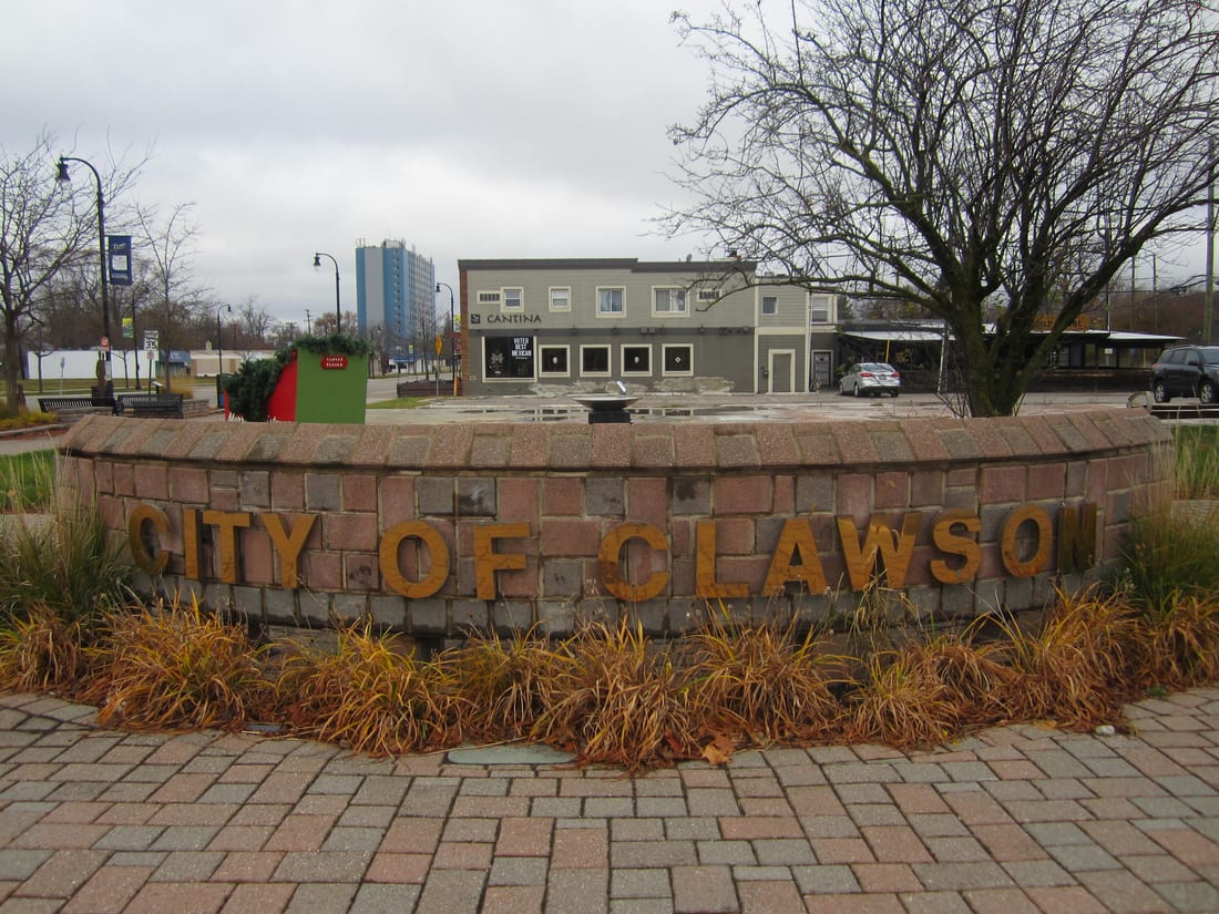 The 'City of Clawson' stone monument in the downtown plaza